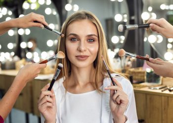 women-holding-make-up-brushes